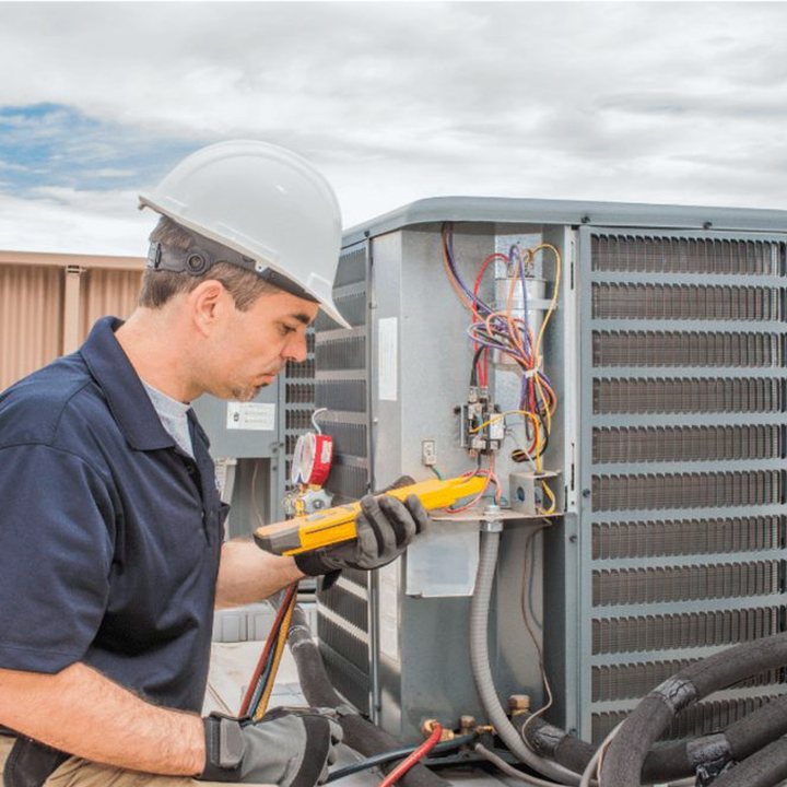 Lambton Heating & Cooling HVAC technician on a service call in Lambton County, Ontario